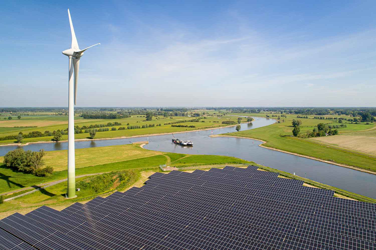 solar-panels-and-wind-turbine-near-ijssel-river-th-7CVYMXU.jpg